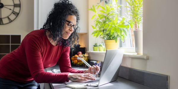 Woman paying bills on computer